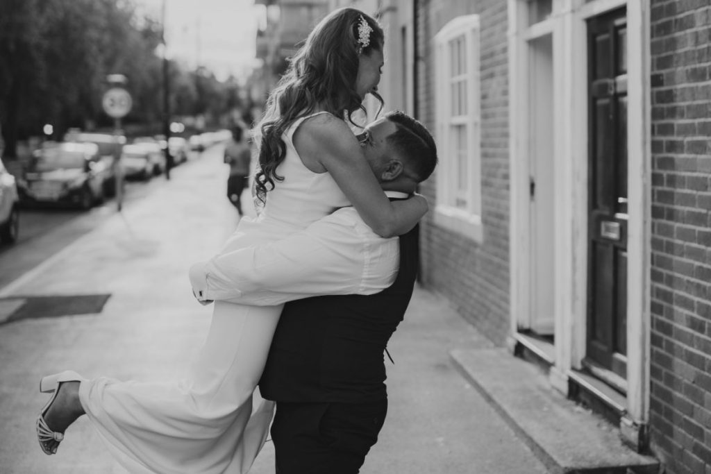 Luxury art deco hotel in Doncaster bride and groom embrace at the earl