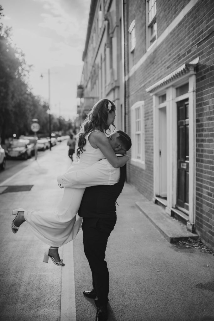 Luxury art deco wedding venue in Doncaster bride and groom cuddle